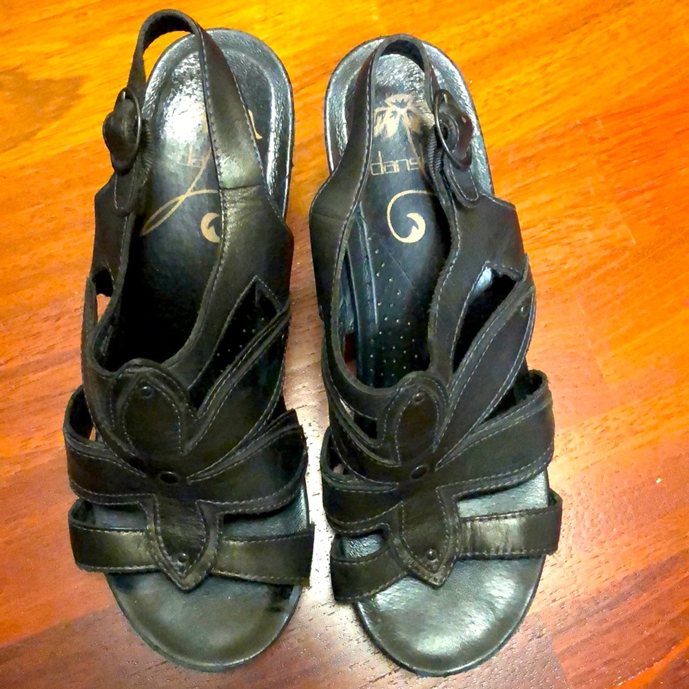 Dansko-open toe sandal. It is scuffed on the heels